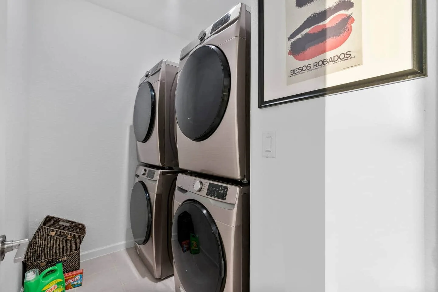 Laundry room with stacked washer and dryer