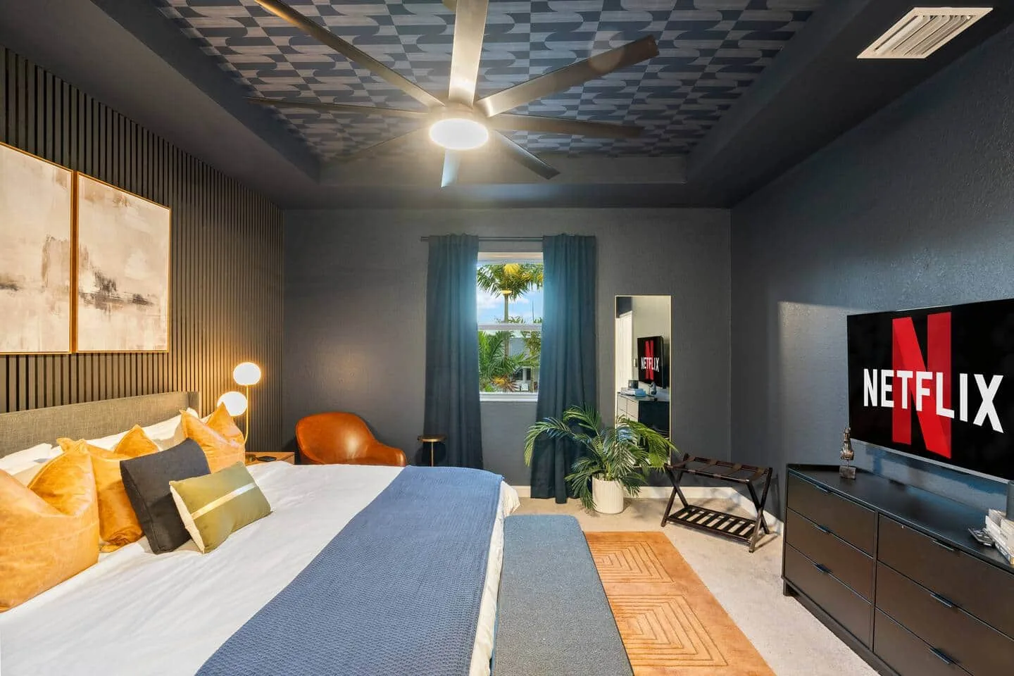 Master suite with smart TV and dresser