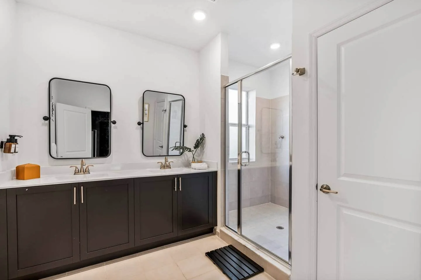 Master bathroom with double vanity and shower