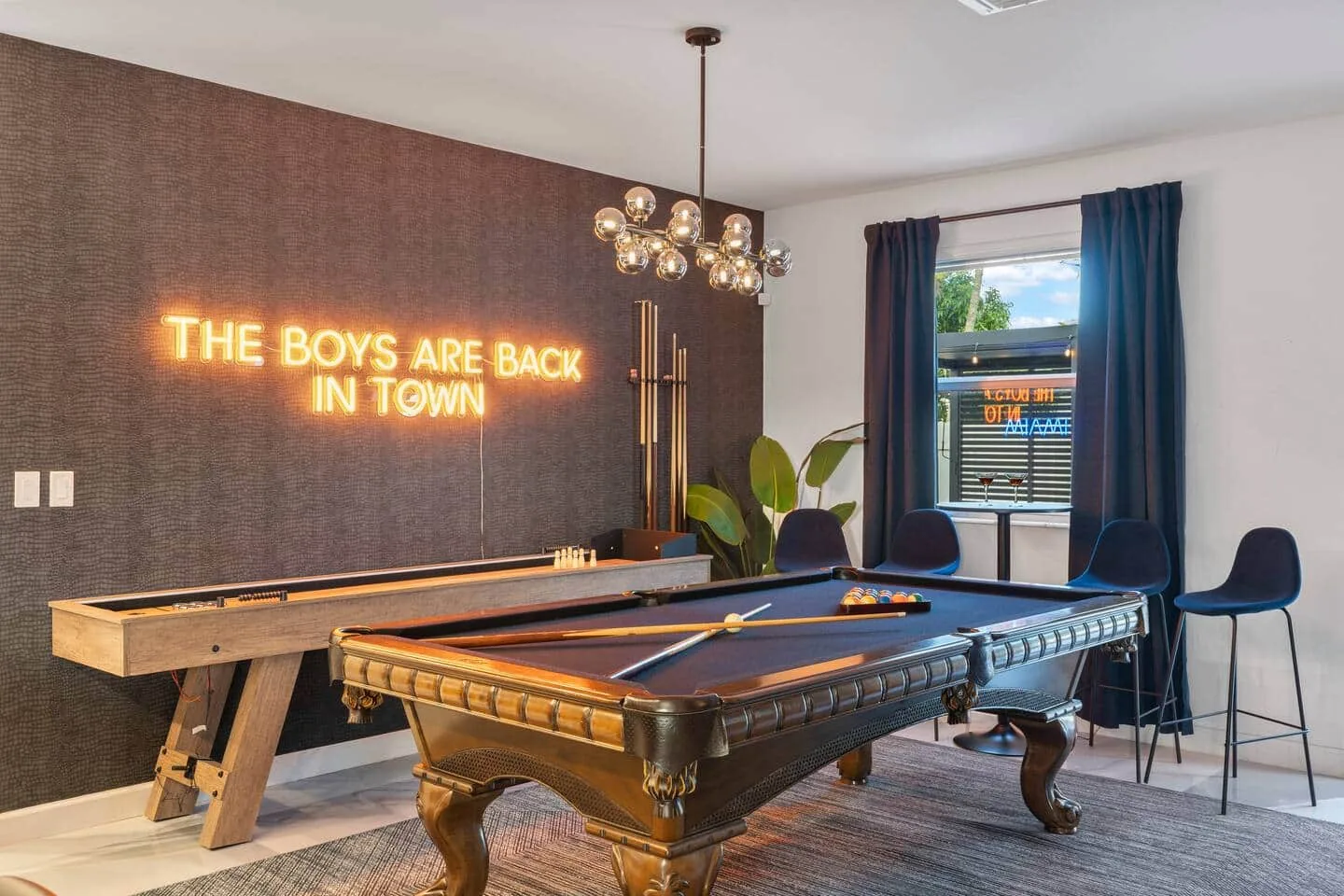 Shuffleboard table and pool table in the game room